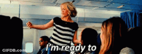 A Woman In A Striped Shirt Says I 'M Ready To On An Airplane GIF