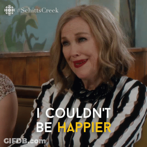 A Woman In A Striped Shirt With The Words I Couldn 'T Be Happier GIF