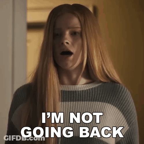 A Woman In A Striped Sweater Is Saying I 'M Not Going Back . GIF