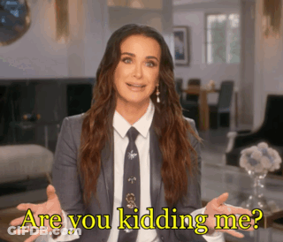 A Woman In A Suit And Tie Says " Are You Kidding Me ? " GIF