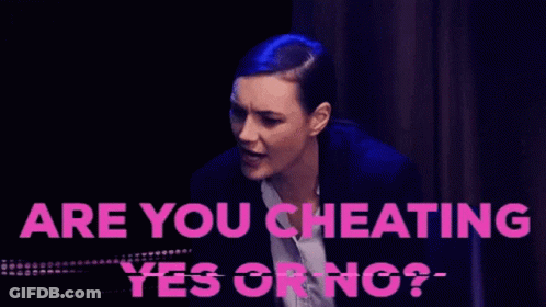 A Woman In A Suit Is Being Asked If She Is Cheating On Her Husband GIF