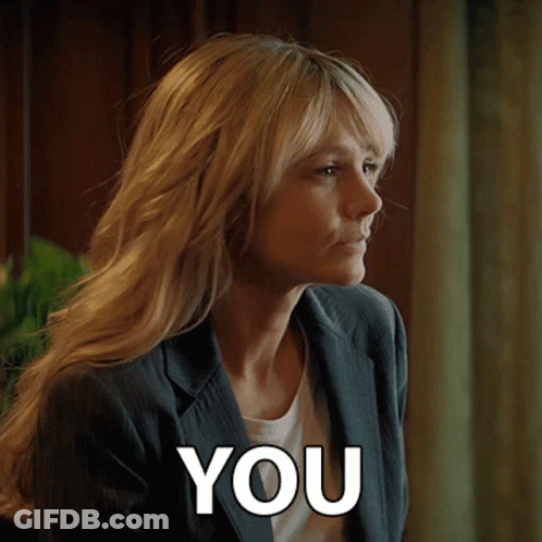A Woman In A Suit Is Saying You GIF