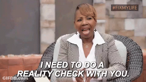 A Woman In A Suit Is Sitting In A Chair And Saying `` I Need To Do A Reality Check With You '' . GIF