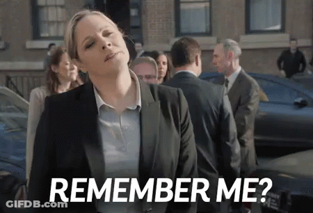 A Woman In A Suit Is Standing In Front Of A Crowd And Says `` Remember Me '' . GIF