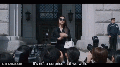 Woman In Suit Talking To Crowd GIF