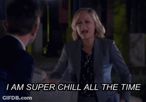 A Woman In A Suit Is Yelling At A Man With The Words I Am Super Chill All The Time Below Her GIF