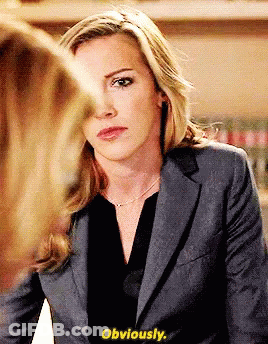 A Woman In A Suit Says Obviously While Looking At Another Woman 'S Face GIF