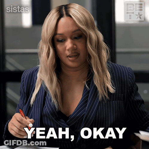A Woman In A Suit Says Yeah Okay While Holding A Red Pen GIF
