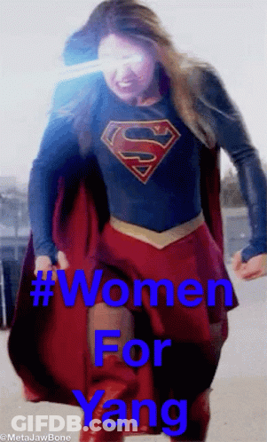 A Woman In A Superman Costume With The Words Women For Yang On The Bottom GIF