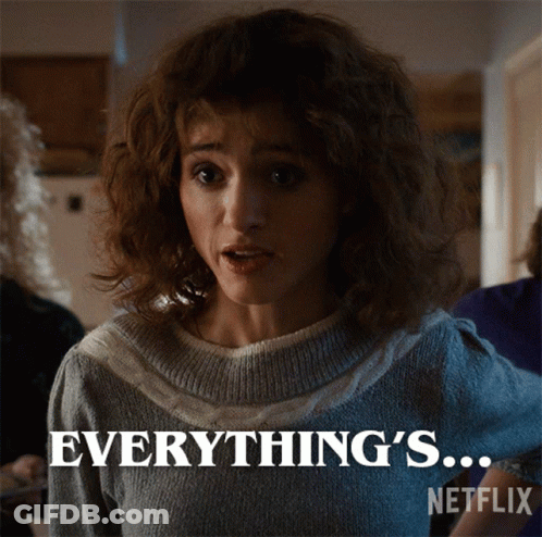 A Woman In A Sweater Says " Everything 'S " On A Netflix Poster GIF
