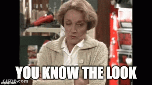 A Woman In A Sweater With The Words You Know The Look Written On It GIF