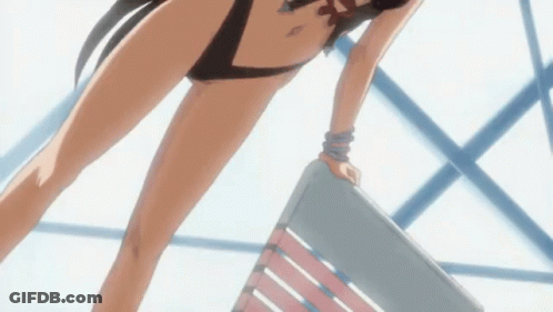 A Woman In A Swimsuit Is Standing On A Chair GIF