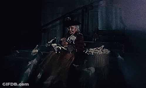 A Woman In A Top Hat Is Holding A Ghost GIF