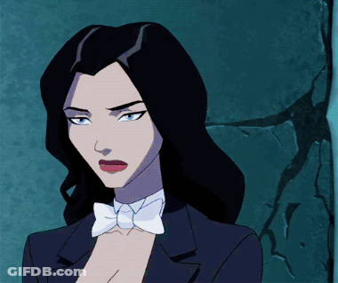 A Woman In A Tuxedo With A Bow Tie GIF