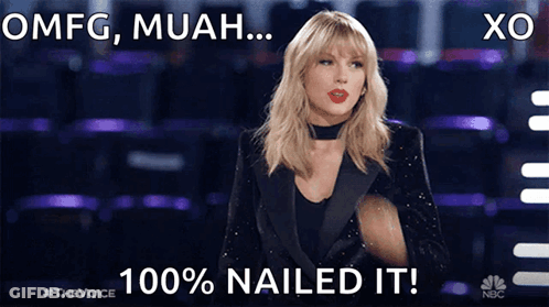 A Woman In A Tuxedo With The Words Omfg Muah 100 % Nailed It On The Bottom GIF