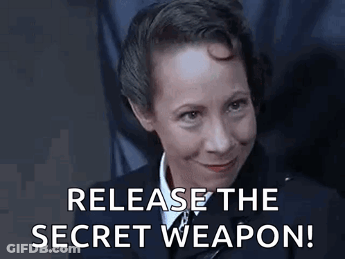 A Woman In A Uniform Is Smiling And Says `` Release The Secret Weapon ! '' GIF
