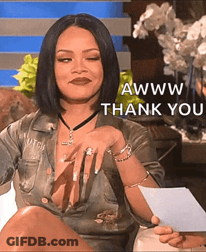 A Woman In A Very Revealing Shirt Is Holding A Piece Of Paper That Says Awww Thank You GIF