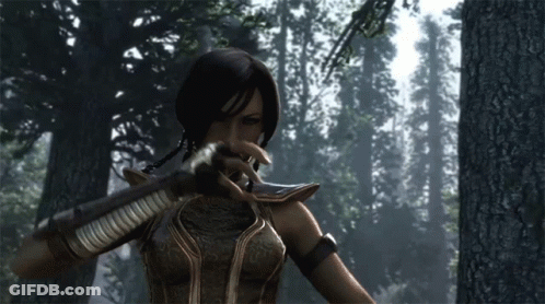 A Woman In A Video Game Holding A Sword In A Forest GIF