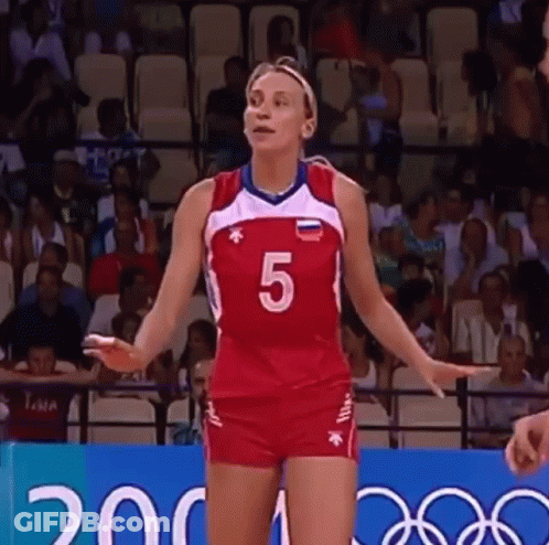 A Woman In A Volleyball Uniform With The Number 5 On It GIF