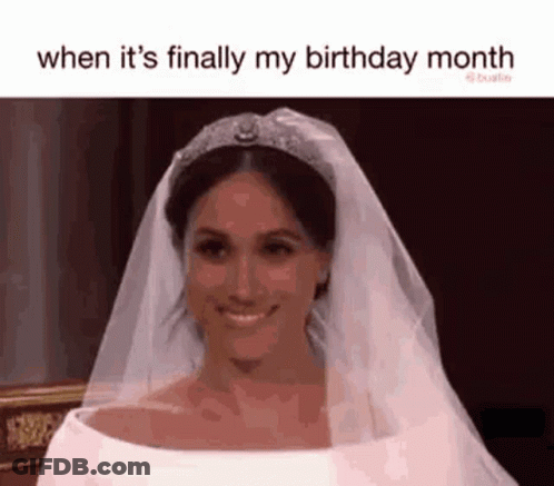 A Woman In A Wedding Dress And Tiara Is Smiling . GIF