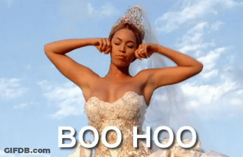 A Woman In A Wedding Dress Is Covering Her Ears With Her Hands And The Words Boo Hoo Are Below Her GIF