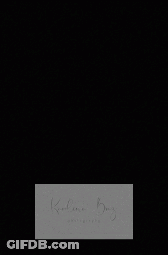 A Woman In A Wedding Dress Sits On A Couch With The Name Karolina Berry Written On The Bottom GIF
