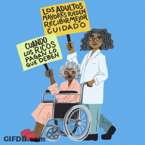 A Woman In A Wheelchair Holds Up A Sign That Says Los Adultos Mayores GIF