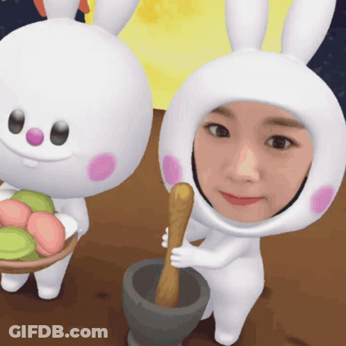 Woman In Bunny Costume Holding Mortar And Pestle GIF