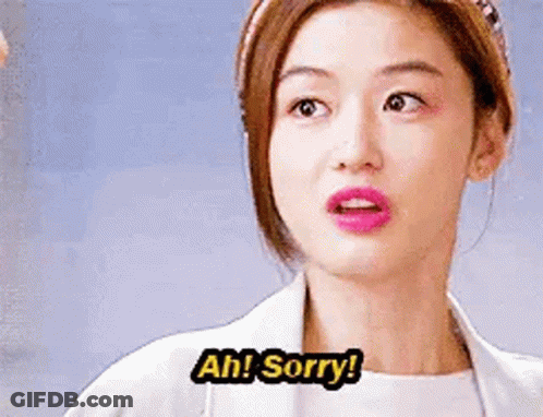 A Woman In A White Coat Is Making A Funny Face And Saying `` Ah ! Sorry ! '' GIF
