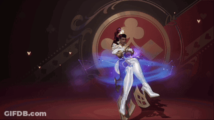 A Woman In A White Costume Is Standing In Front Of A Playing Card Symbol GIF