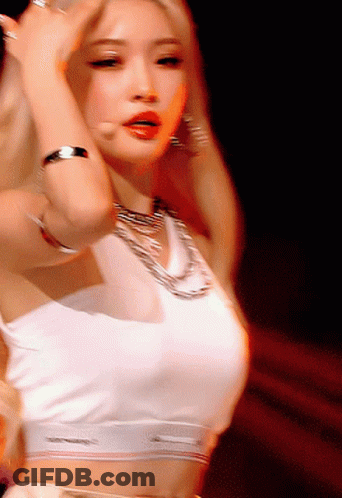 A Woman In A White Crop Top Is Dancing GIF