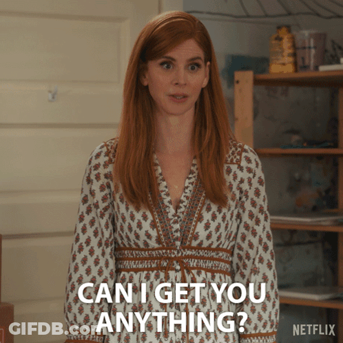 A Woman In A White Dress Is Asking If She Can Get You Anything GIF