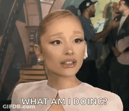 A Woman In A White Dress Is Asking What Am I Doing ? GIF