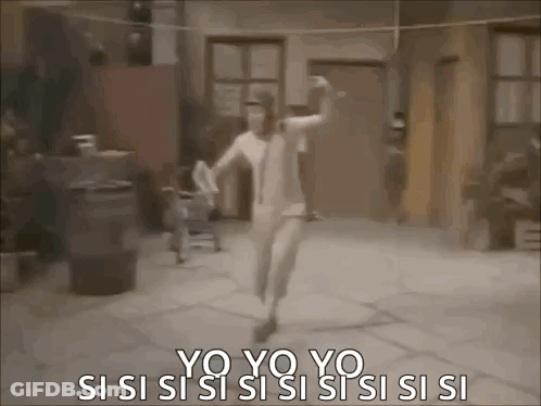 A Woman In A White Dress Is Dancing In Front Of A Building . GIF
