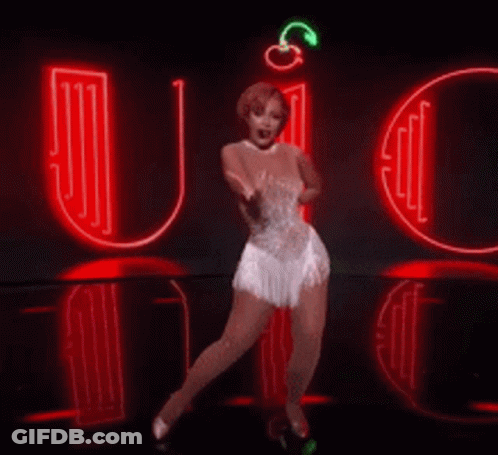 A Woman In A White Dress Is Dancing In Front Of A Neon Sign That Says It 'S Quiet Ain T No Back Talk GIF