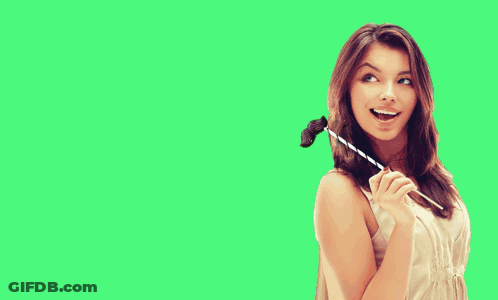 A Woman In A White Dress Is Holding A Straw In Front Of A Green Field GIF