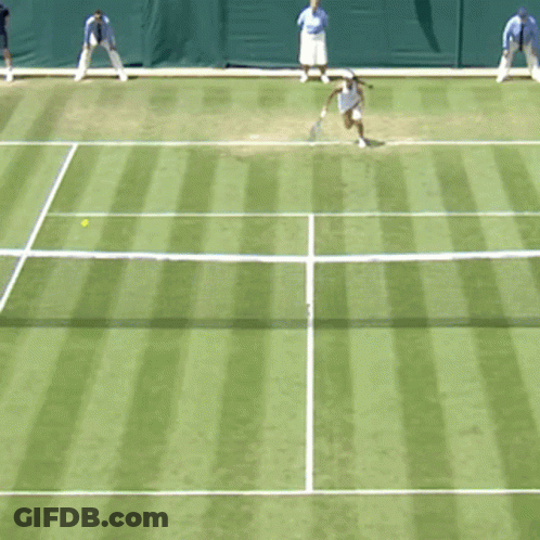 A Woman In A White Dress Is Holding A Tennis Racquet GIF