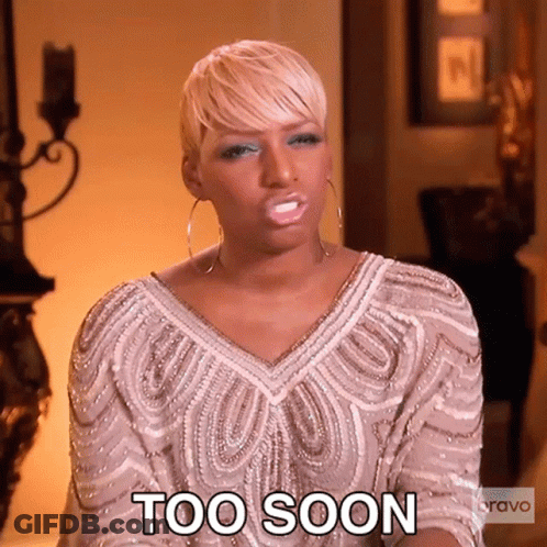 A Woman In A White Dress Is Making A Face And Says Too Soon . GIF