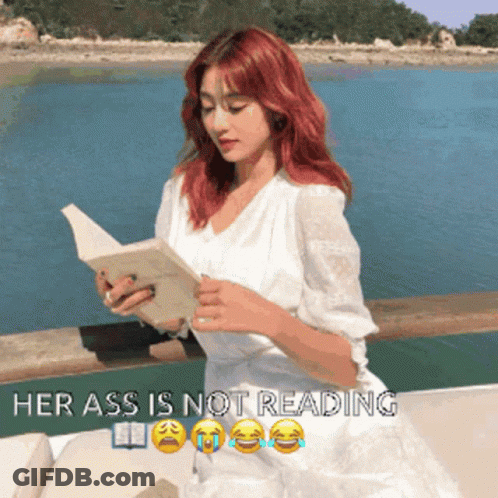 A Woman In A White Dress Is Reading A Book With The Words Her Ass Is Not Reading Above Her GIF