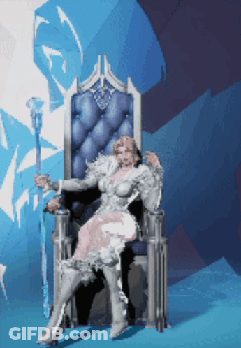 A Woman In A White Dress Is Sitting In A Chair GIF