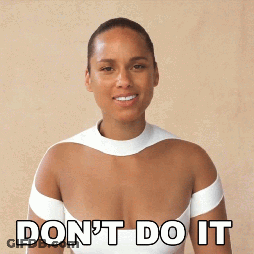 A Woman In A White Dress Is Smiling And Says " Don 'T Do It " GIF