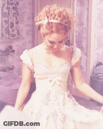 A Woman In A White Dress Is Smiling With The Words Made With Reface App Below Her GIF