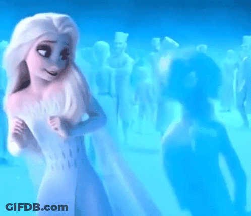 A Woman In A White Dress Is Standing In Front Of A Crowd Of People In A Blue Room . GIF