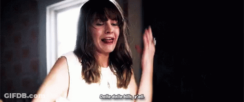 A Woman In A White Dress Is Standing In Front Of A Window With Her Hands In The Air . GIF