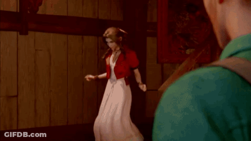 A Woman In A White Dress Is Standing Next To A Man In A Green Shirt GIF