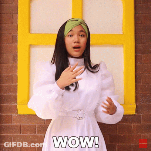 A Woman In A White Dress Says Wow GIF