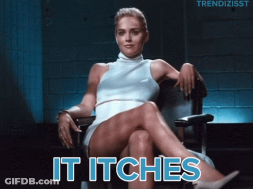 A Woman In A White Dress Sits In A Chair With The Words " It Itches " Below Her GIF