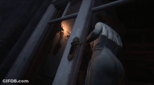 A Woman In A White Dress Stands In A Dark Room GIF