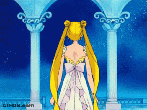 A Woman In A White Dress With A Bow On The Back GIF