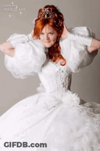 A Woman In A White Dress With A Tiara On Her Head Is Made With The Reface App GIF